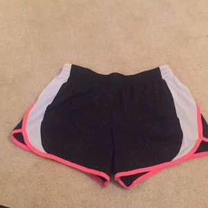 Black athletic shorts tat will fit a women’s small